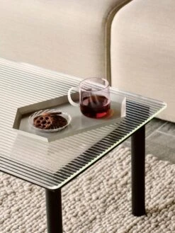 HAY Kofi Table 140 X 50 Cm, Black Lacquered Oak - Reeded Glass -Finnishdesignshop Kaleido M grey Borosilicate Mug pink with white handle Spin Saucer clear with white stripe